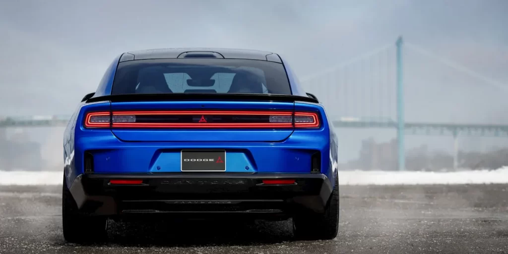 Close-up of 2026 Dodge Charger Daytona Scat Pack EV’s aggressive front fascia and illuminated Fratzog badge