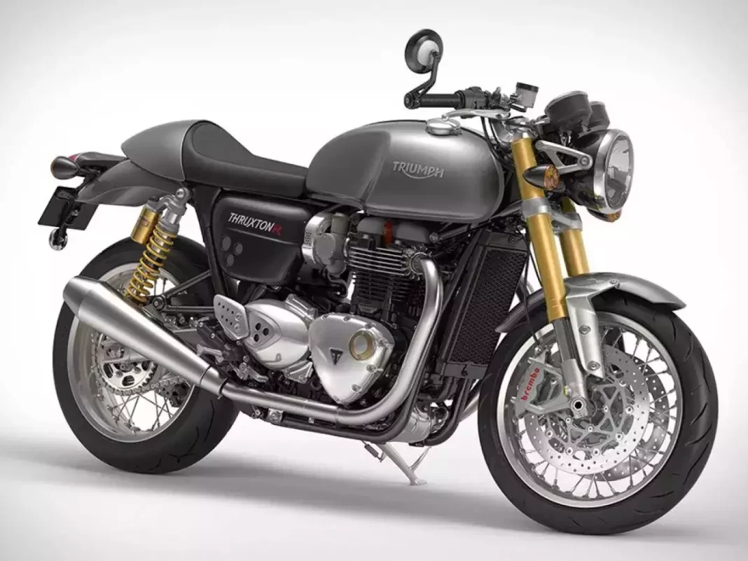 Triumph 400cc café racer prototype undergoing road tests in Europe with retro design elements.